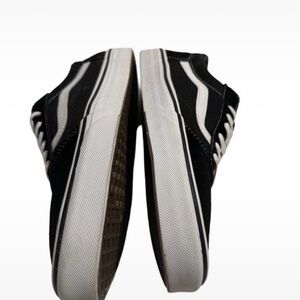 Vans Black and White Sneakers with Canvas Upper and Contrasting Laces